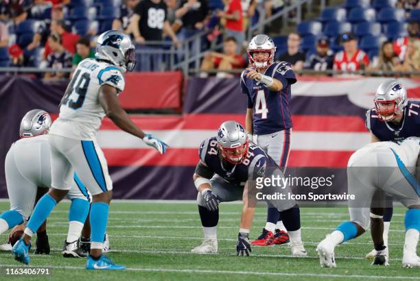 New England Patriots quarterback Jarrett Stidham points out Carolina Panthers linebacker Antwione Williams during a preseason game between the New...