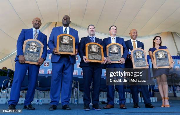 Inductees Harold Baines, Lee Smith, Edgar Martinez, Mike Mussina, Mariano Rivera and Brandy Halladay, wife the late Roy Halladay, pose with their...