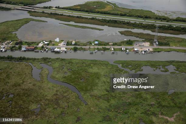 Homes on Ridgeway Blvd. Are surrounded by water and marshland near Lake Pontchartrain on August 23, 2019 in New Orleans, Louisiana. According to...