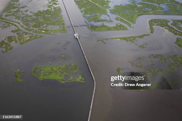 The $1.1 billion Lake Borgne Surge Barrier stands near the confluence of and across the Gulf Intracoastal Waterway and the Mississippi River Gulf...