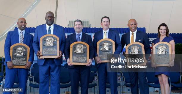Inductees Harold Baines, Lee Smith, Edgar Martinez, Mike Mussina, Mariano Rivera and Brandy Halladay, wife the late Roy Halladay, pose with their...