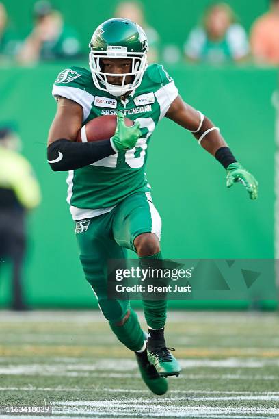 Loucheiz Purifoy of the Saskatchewan Roughriders returns a kick in the game between the BC Lions and Saskatchewan Roughriders at Mosaic Stadium on...