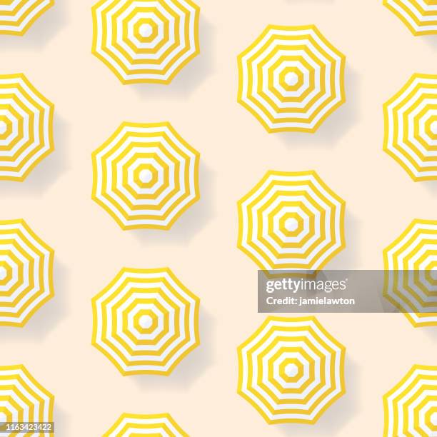 seamless summer beach umbrella pattern - beach umbrella top view stock illustrations