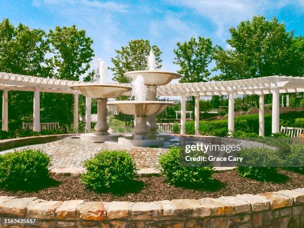 water flows from fountains in idyllic community - fredericksburg stock pictures, royalty-free photos & images