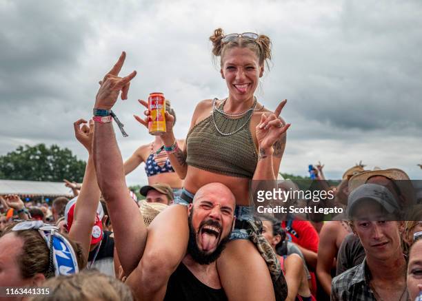 Country music fans attend day 3 of Faster Horses Festival 2019 at Michigan International Speedway on July 21, 2019 in Brooklyn, Michigan.