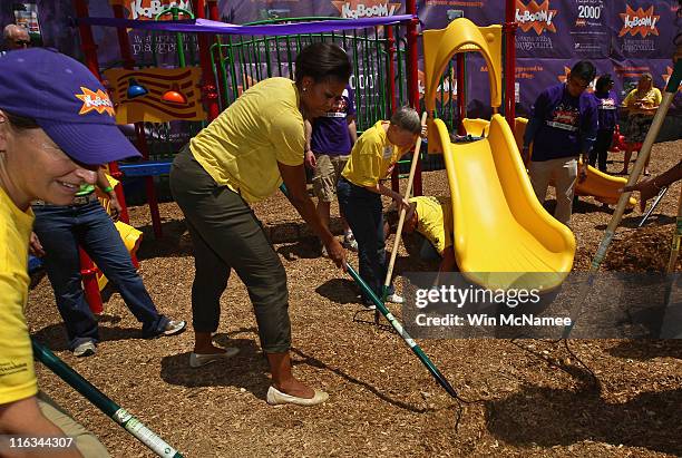 First lady Michelle Obama helps to construct a playground at the Imagine Southeast Public Charter Elementary School June 15, 2011 in Washington, DC....