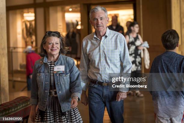Jerome Powell, chairman of the U.S. Federal Reserve and Elissa Leonard arrive for a dinner during the Jackson Hole economic symposium, sponsored by...