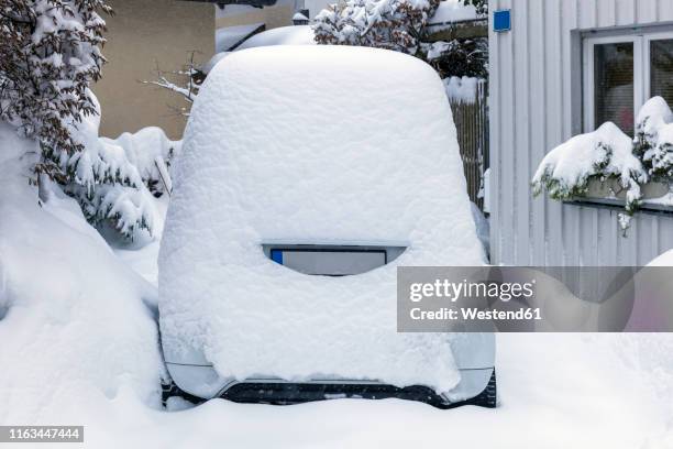 snow-covered compact car, germany - schneebedeckt stock-fotos und bilder