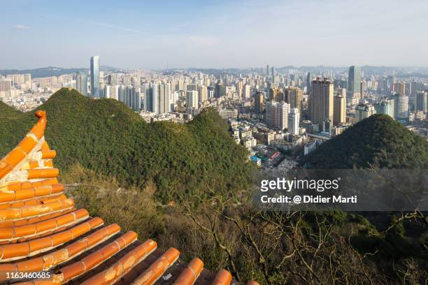 guiyang cityscape from the top of the qianlingshan park in quizhou provincial capital city - newly industrialized country imagens e fotografias de stock