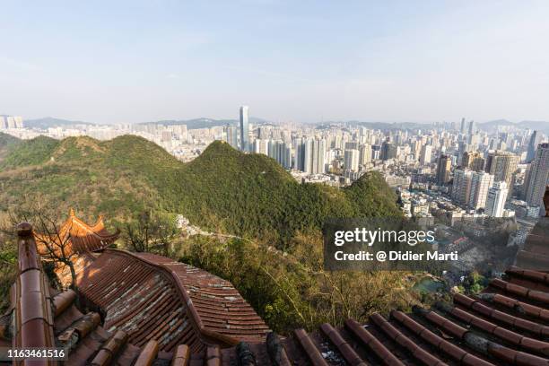 guiyang cityscape from the top of the qianlingshan park in quizhou provincial capital city - tillväxtmarknad bildbanksfoton och bilder