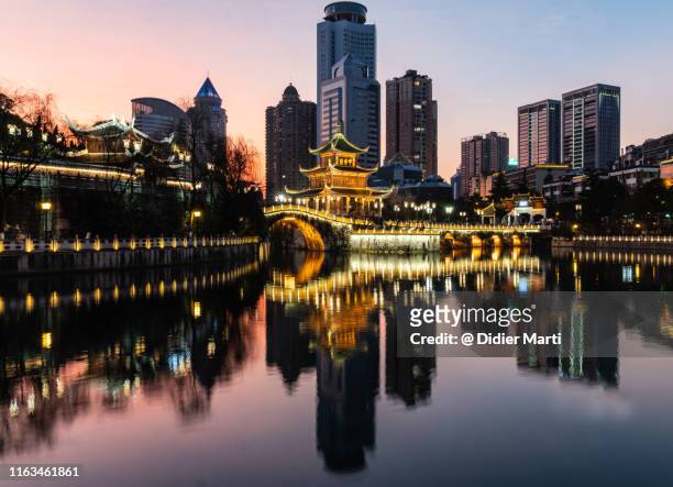 stunning sunset over the guiyang cityscape with the historic jiaxu tower, china - newly industrialized country stock pictures, royalty-free photos & images