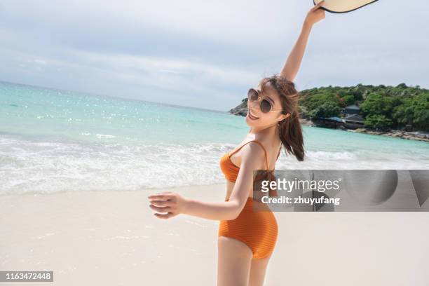 woman at sea beach - beautiful beach babes stock pictures, royalty-free photos & images