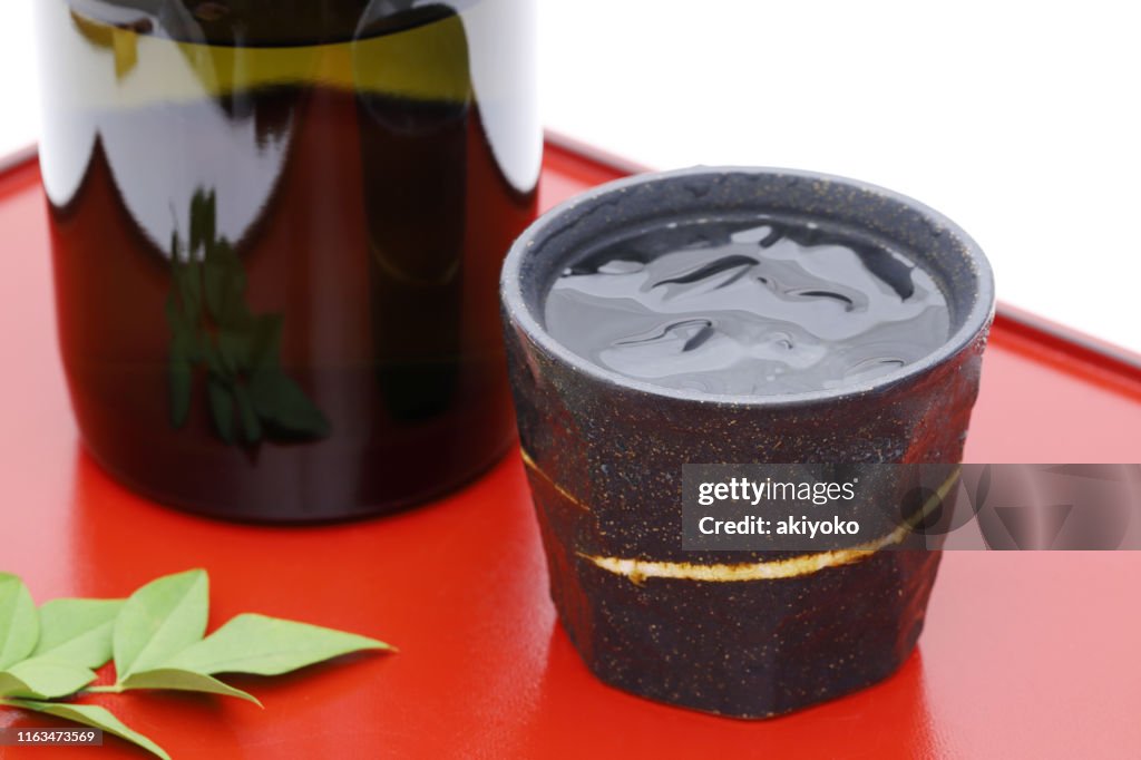 Bottle of Japanese shochu and ceramic bowl