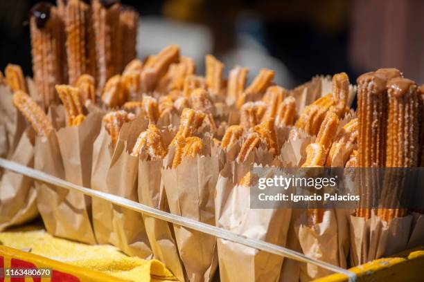 churros for sale in a market in cuzco, peru - churros stock pictures, royalty-free photos & images