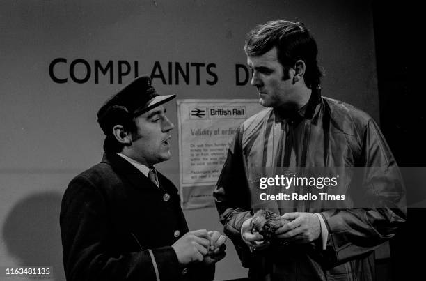 Comedians Terry Jones and John Cleese in the 'Dead Parrot' sketch from series 1 of the BBC television show 'Monty Python's Flying Circus', 1969.