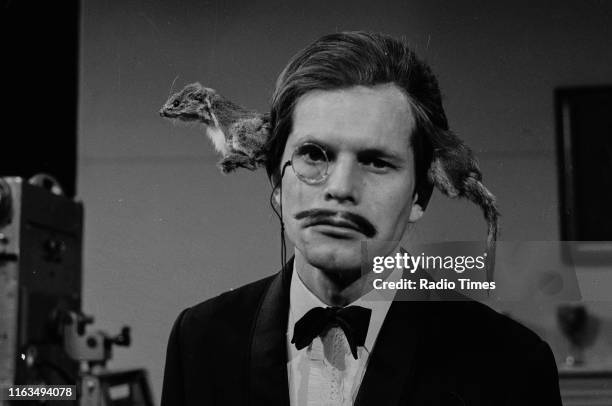 Comedian and director Terry Gilliam as 'a man with a stoat through his head' in a sketch from series 2 of the BBC television show 'Monty Python's...