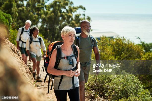 hiking keeps us all healthy and positive - diverse mature men stock pictures, royalty-free photos & images