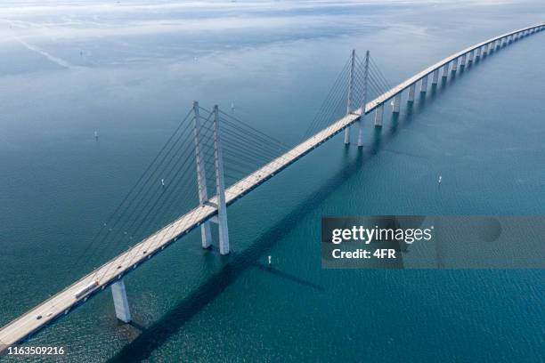 øresund, öresund bridge connecting sweden with denmark - malmö stock pictures, royalty-free photos & images