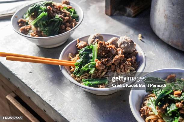 making javanese chicken noodles, the best noodles in town - chicken noodle soup stock pictures, royalty-free photos & images