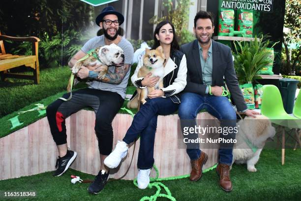Faisy,Ela Velden and Patricio Borghetti poses for photos during a press conference to launching of dog food 'Extra Life' of Dog Chow at Fideicomiso...
