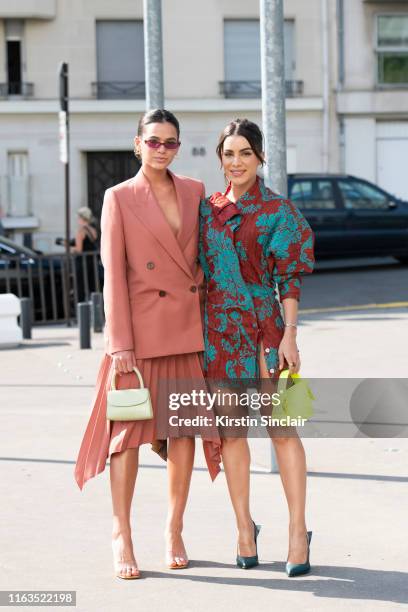 Actress Bruna Marquezine wears all Acne Studios with By Far bag and shoes with Digital Influencer Camila Coehlo wearing all Acne Studios with Lili...