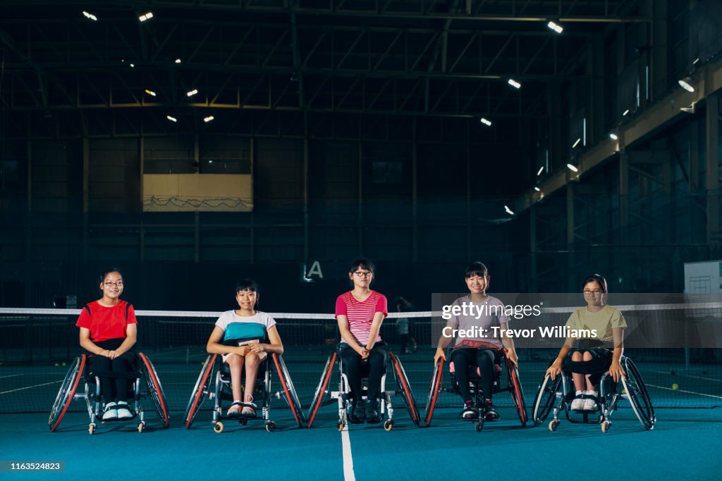 Portrait of five young female wheelchair tennis athletes