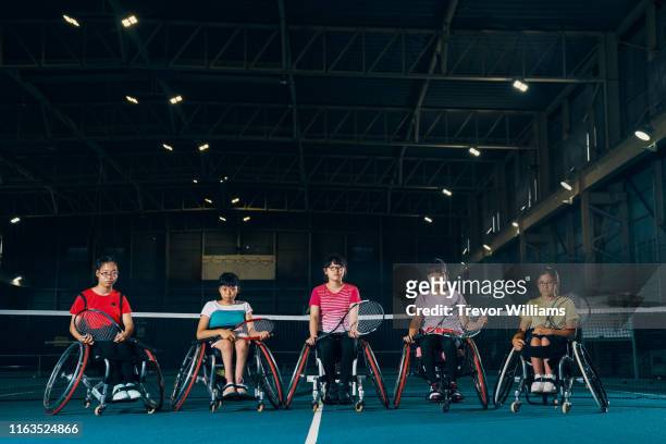 Portrait of five young female wheelchair tennis athletes