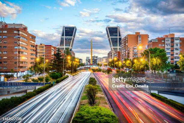 financial district with kio towers in paseo de la castellana avenue at dusk, madrid. spain - madrid stock pictures, royalty-free photos & images