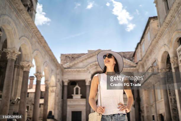 tourist exploring beautiful square in split, croatia - croatia stock pictures, royalty-free photos & images