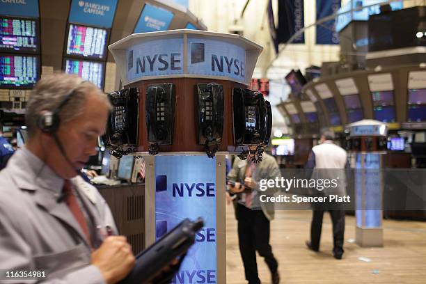 Traders work on the floor of the New York Stock Exchange before the close on June 15, 2011 in New York City. Reversing much of the previous day's...