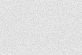 Black and white grainy abstract background. Halftone - pointillism pattern with random dots.