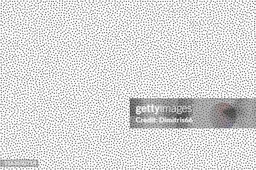 Black and white grainy abstract background. Halftone - pointillism pattern with random dots. Black and white grainy abstract background. Halftone - pointillism pattern with random dots.