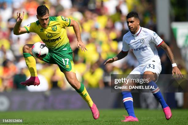 Norwich City's Argentinian midfielder Emiliano Buendía controls the ball in front of Chelsea's Brazilian-Italian defender Emerson Palmieri during the...