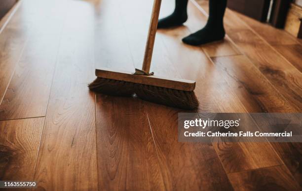 brushing the floor - mop up stock pictures, royalty-free photos & images