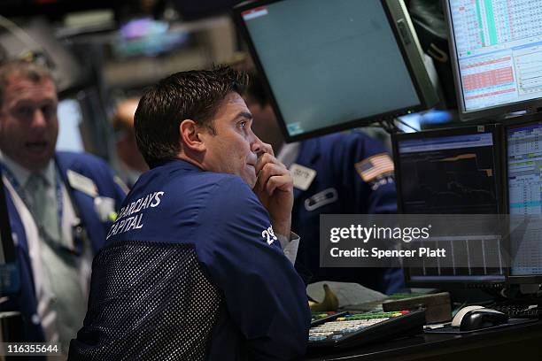 Traders work on the floor of the New York Stock Exchange before the close on June 15, 2011 in New York City. Reversing much of the previous day's...