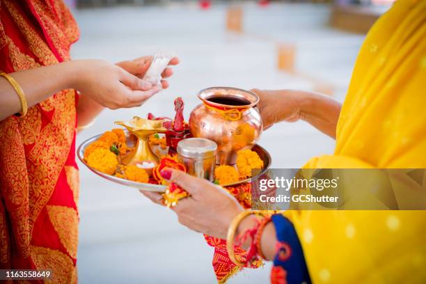 religious women at a hindu temple getting ready for the prayers - the dussehra vijaya dashami festival stock pictures, royalty-free photos & images