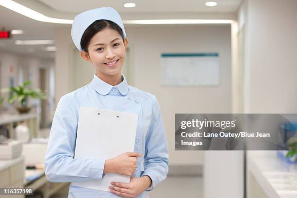 portrait of a confident nurse - nurse hat stock pictures, royalty-free photos & images