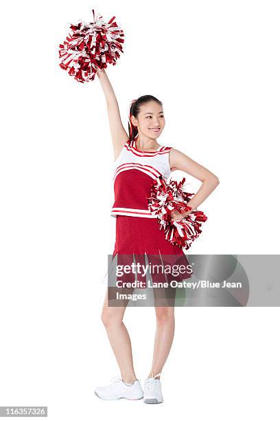 portrait of a cheerleader in red - asian cheerleaders stock-fotos und bilder