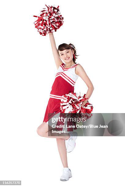 cheerleader in action with her pom-poms - asian cheerleaders ストックフォトと画像