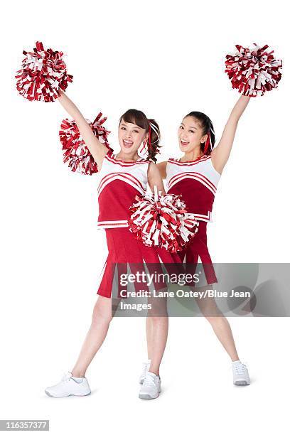 cheerleaders in action - cheerleader white background stock pictures, royalty-free photos & images