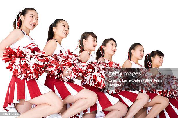 cheerleaders performing a routine - asian cheerleaders ストックフォトと画像