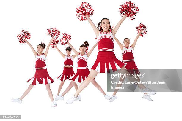 cheerleaders performing a routine - asian cheerleaders ストックフォトと画像