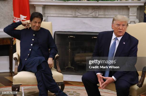 President Donald Trump speaks to the media during a meeting with Prime Minister of the Islamic Republic of Pakistan, Imran Khan in the Oval Office at...