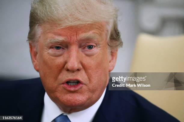 President Donald Trump speaks to the media during a meeting with Prime Minister of the Islamic Republic of Pakistan, Imran Khan in the Oval Office at...