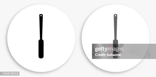 butter knife black and white round icon - butter knife stock illustrations