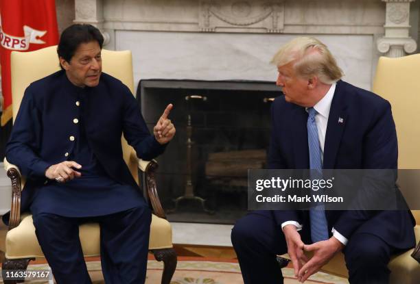 President Donald Trump and Prime Minister of the Islamic Republic of Pakistan, Imran Khan, speak to the media during a meeting in the Oval Office at...