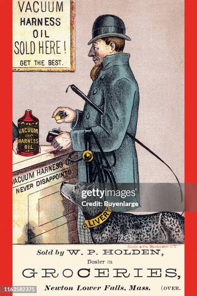 Victorian trade card advertises Vacuum Harness oil , 1889. It depicts a man as he purchases a bottle of the oil while his dog, whose collar reads...