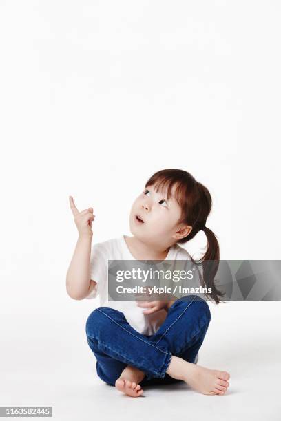 hope, love, happiness, a cute kid, fun - girls barefoot in jeans stockfoto's en -beelden