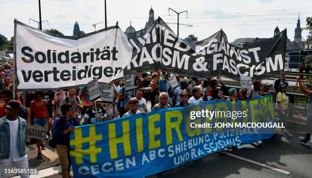 Protesters take part in a demonstration titled "Unteilbar" against exclusion on August 24, 2019 in Dresden, eastern Germany. - Thousands of civil...