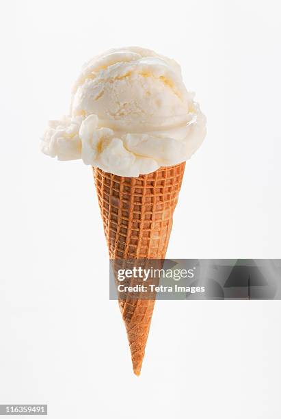 close up of vanilla ice cream cone - アイスクリーム ストックフォトと画像